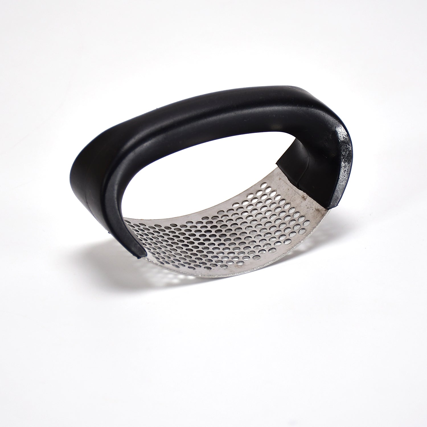 Stainless steel garlic crusher with comfortable grip handle. Stainless steel garlic crusher with comfortable grip handle.